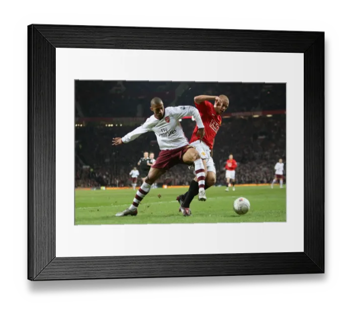 Framed Print : Armand Traore (Arsenal) Wes Brown (Man Utd)