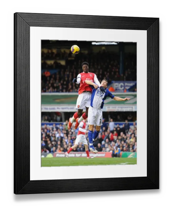 Framed Print : Emmanuel Adebayor (Arsenal) Stephen Kelly (Birmingham City)