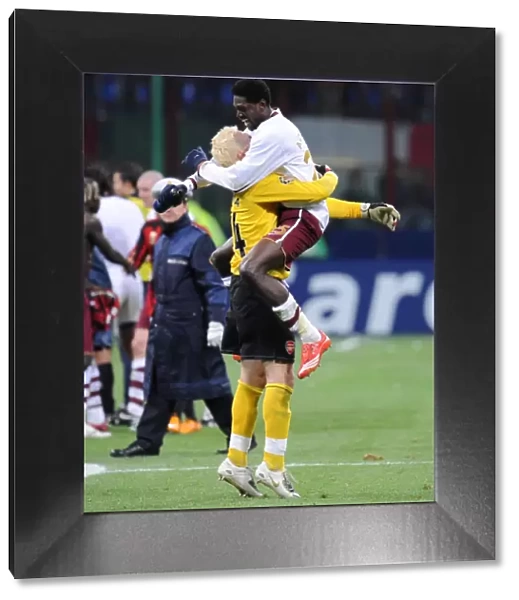 Emmanuel Adebayor and Manuel Almunia celebrate Arsenals victory