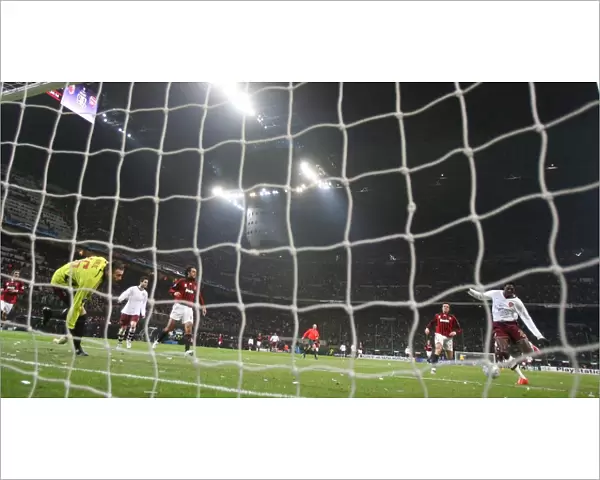 Emmanuel Adebayor shoots past AC Milan goalkeeper Zelijo Kalac to score the 2nd Arsenal goal
