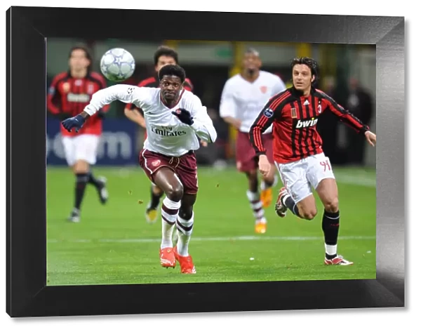 Adebayor's Double Strikes: Arsenal Overpowers AC Milan 2-0 in Champions League Showdown (Oddo, Milan)