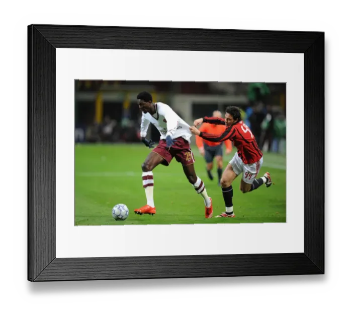 Framed Print : Adebayor's Double Strike: Arsenal Overpowers AC Milan in Champions League Showdown (Massimo Oddo) Framed Print : Adebayor's Double Strike: Arsenal Overpowers AC Milan in Champions League Showdown (Massimo Oddo)