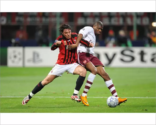 Abu Diaby (Arsenal) Massimo Oddo (AC Milan)