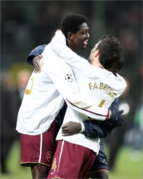 Emmanuel Adebayor celebrates at the final whistle with Cesc Fabregas (Arsenal)