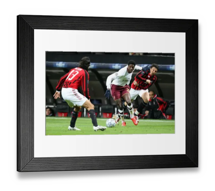 Framed Print : Arsenal's Adebayor Scores Twice as Gunners Top Milan in UEFA Champions League Framed Print : Arsenal's Adebayor Scores Twice as Gunners Top Milan in UEFA Champions League