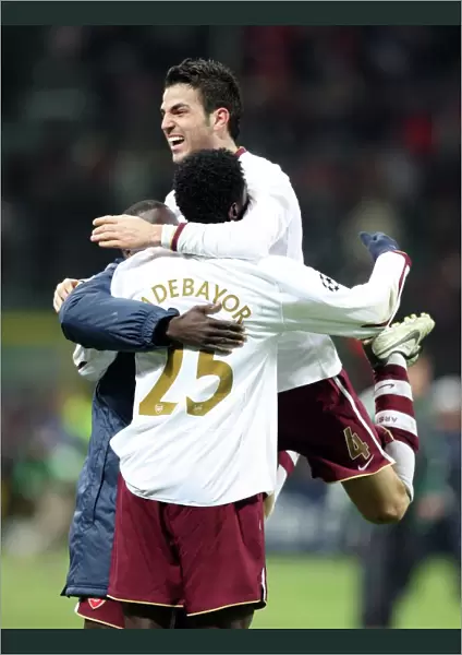 Celebration at San Siro: Fabregas, Eboue, and Adebayor Rejoice in Arsenal's 2-0 UEFA Champions League Victory over AC Milan