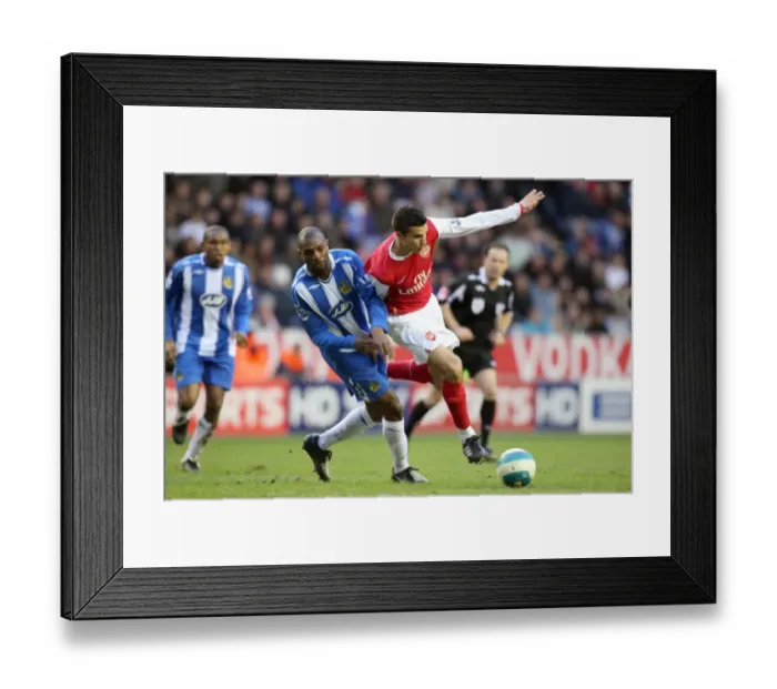 Framed Print : Van Persie vs. Boyce: A Battle of Defenses - Arsenal vs. Wigan, 08-09 Premier League: 0-0 Stalemate at JJB Stadium
