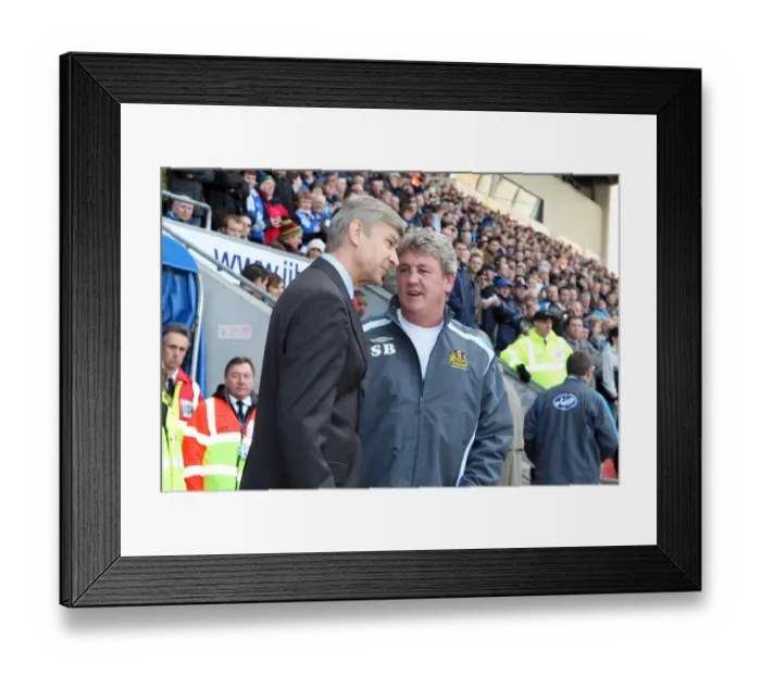 Framed Print : Arsene Wenger the Arsenal Manager speaks to Steve Bruce the Wigan Manager before the match Framed Print : Arsene Wenger the Arsenal Manager speaks to Steve Bruce the Wigan Manager before the match