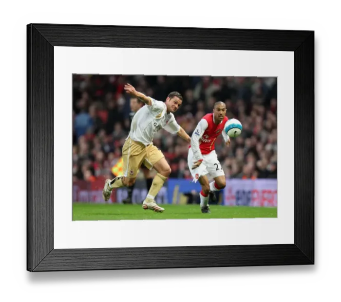 Framed Print : Clash of the Left Flanks: Gael Clichy (Arsenal) vs. Luke Young (Middlesbrough) - 1:1 Stalemate in the Barclays Premier League