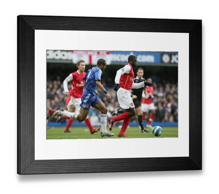 Framed Print : Clash of Rivals: Eboue vs. Cole at Stamford Bridge - Chelsea Edge Past Arsenal 2:1 in Premier League