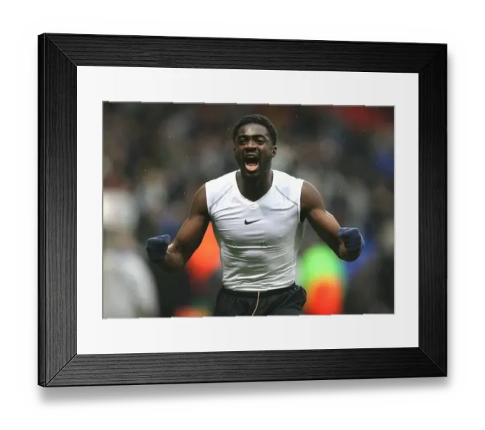 Framed Print : Kolo Toure celebrates the Arsenal victory after the match Framed Print : Kolo Toure celebrates the Arsenal victory after the match
