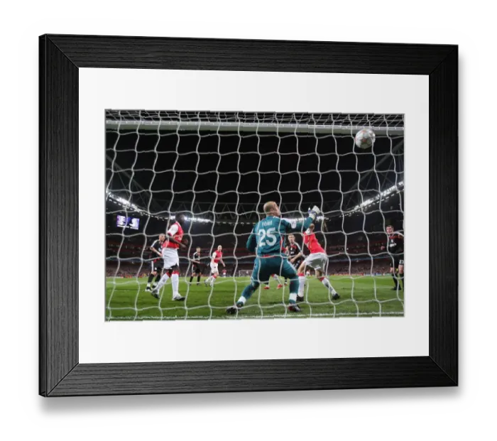 Framed Print : Emmanuel Adebayor heads past Liverpool Pepe Reina to scote the Arsenal goal Framed Print : Emmanuel Adebayor heads past Liverpool Pepe Reina to scote the Arsenal goal