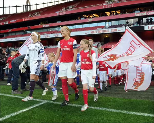 Katie Chapman (Arsenal Ladies) and Carly Telford (Chelsea) lead out their teams