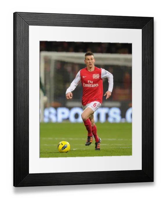 Framed Print : Laurent Koscielny Focuses in Bolton Wanderers vs Arsenal Premier League Clash