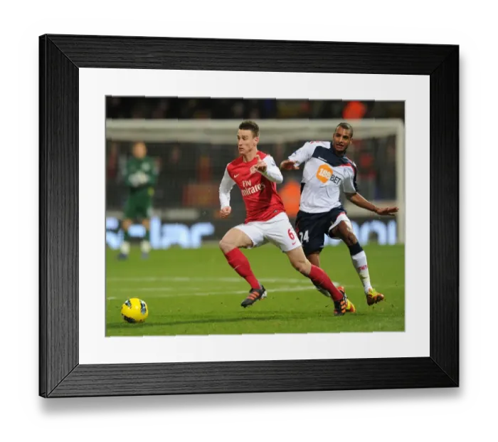 Framed Print : Laurent Koscielny Surges Past David Ngog: Bolton Wanderers vs. Arsenal, Premier League 2011-12 Framed Print : Laurent Koscielny Surges Past David Ngog: Bolton Wanderers vs. Arsenal, Premier League 2011-12