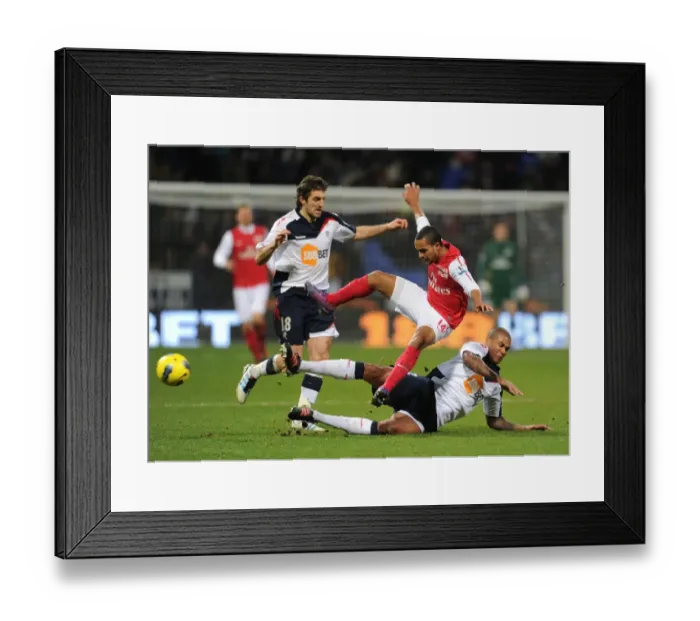 Framed Print : Theo Walcott vs Zat Knight: A Fierce Football Rivalry - Arsenal vs Bolton Wanderers, 2011-12 Framed Print : Theo Walcott vs Zat Knight: A Fierce Football Rivalry - Arsenal vs Bolton Wanderers, 2011-12