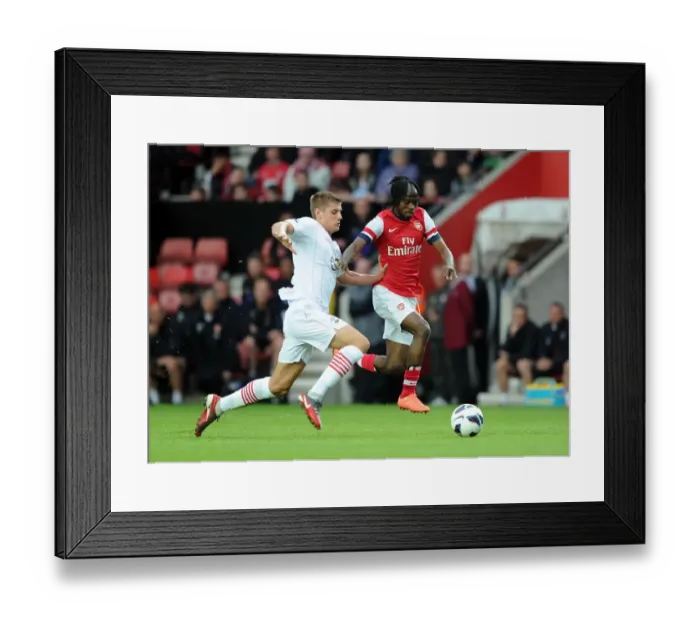 Framed Print : Gervinho vs. Jack Stephens: Clash in the 2012-13 Southampton vs. Arsenal Pre-Season Match