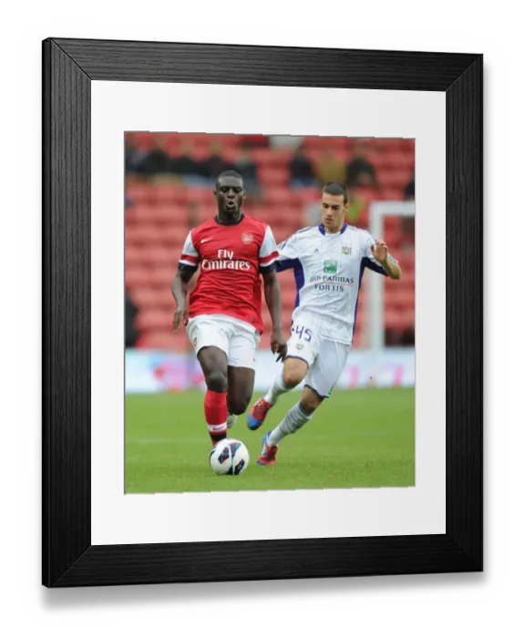 Framed Print : Arsenal's Danny Boateng Faces Off Against Anderlecht's Behrang Safari in 2012 Pre-Season Match
