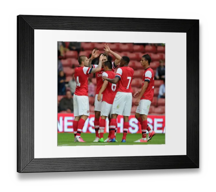 Framed Print : Arsenal Celebrate Henri Lansbury's Goal Against Anderlecht in 2012 Pre-Season
