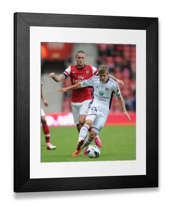 Framed Print : Arsenal vs. Anderlecht: Henri Lansbury Tackles Dennis Praet in the 2012-13 Pre-Season Clash