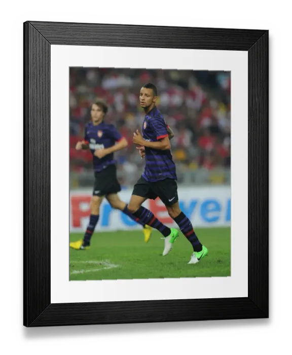 Framed Print : Arsenal FC Training in Malaysia: Craig Eastmond in Action during Malaysia XI Friendly, 2012 Framed Print : Arsenal FC Training in Malaysia: Craig Eastmond in Action during Malaysia XI Friendly, 2012