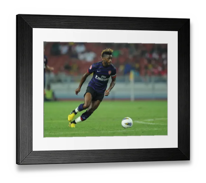 Framed Print : Arsenal's Alex Song in Action against Malaysia XI during 2012 Pre-Season Friendly Framed Print : Arsenal's Alex Song in Action against Malaysia XI during 2012 Pre-Season Friendly