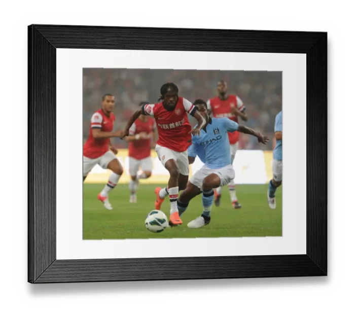 Framed Print : Arsenal vs Manchester City: Gervinho Breaks Past Razak in Beijing Pre-Season Clash, 2012 Framed Print : Arsenal vs Manchester City: Gervinho Breaks Past Razak in Beijing Pre-Season Clash, 2012