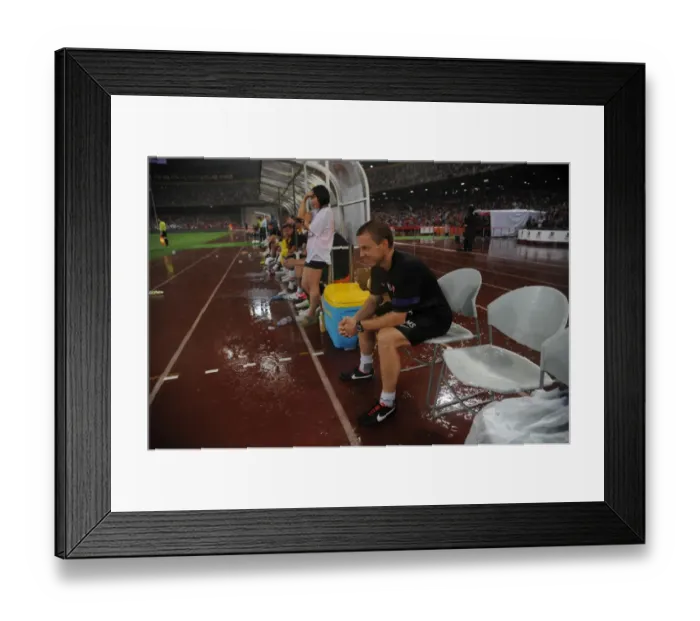 Framed Print : Arsenal FC vs Manchester City: Marcus Szensson Leads Arsenal's Fitness Training at 2012 Beijing Pre-Season Clash