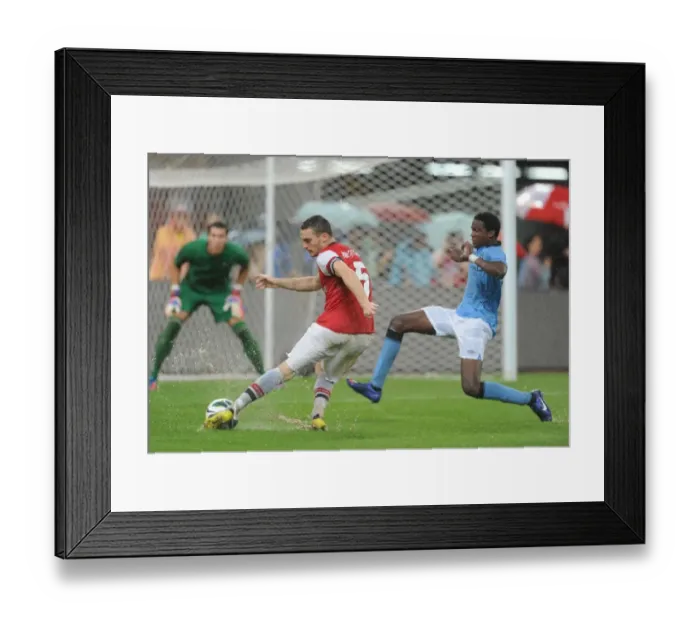 Framed Print : Arsenal vs Manchester City: Thomas Vermaelen Scores Past Dedryck Boyata in Beijing, 2012
