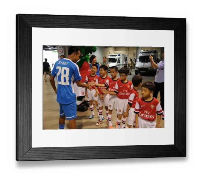 Framed Print : Player Escorts Align Before Kitchee FC vs. Arsenal FC, 2012