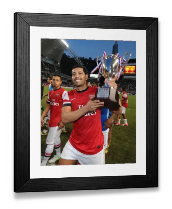 Framed Print : Andre Santos Lifts Arsenal's Pre-Season Trophy after Kitchee FC Victory, 2012