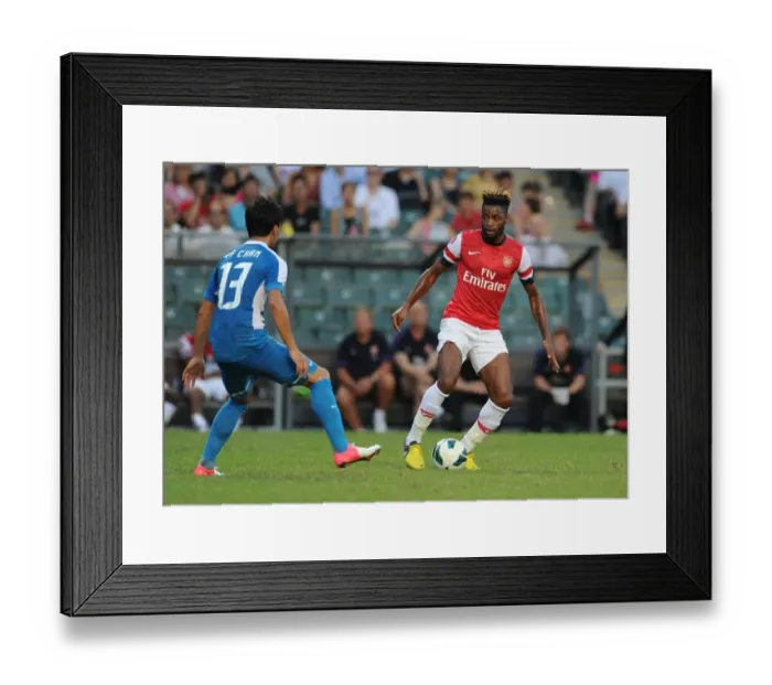 Framed Print : Alex Song vs. Chan Man Fai: Clash of the Midfielders - Kitchee FC vs. Arsenal FC (2012) Framed Print : Alex Song vs. Chan Man Fai: Clash of the Midfielders - Kitchee FC vs. Arsenal FC (2012)