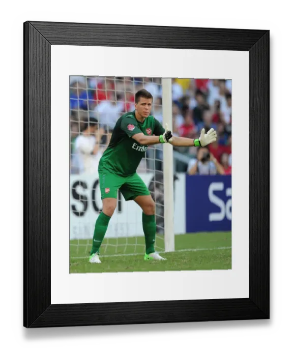 Framed Print : Wojciech Szczesny: In Action for Arsenal FC against Kitchee (2012-13) Framed Print : Wojciech Szczesny: In Action for Arsenal FC against Kitchee (2012-13)