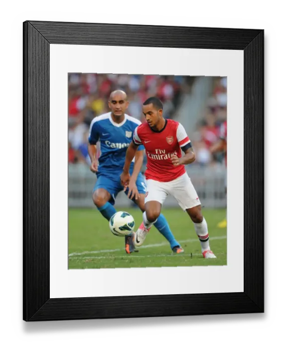 Framed Print : Theo Walcott Outmaneuvers Zeshan Rehman: Kitchee FC vs. Arsenal FC, 2012