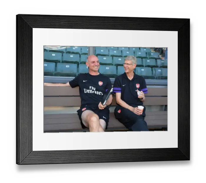 Framed Print : Arsene Wenger and Steve Bould Share a Laugh Before Kitchee FC vs. Arsenal FC Match (2012) Framed Print : Arsene Wenger and Steve Bould Share a Laugh Before Kitchee FC vs. Arsenal FC Match (2012)