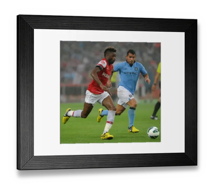 Framed Print : Clash of Titans: Alex Song vs. Carlos Tevez - Arsenal FC vs. Manchester City