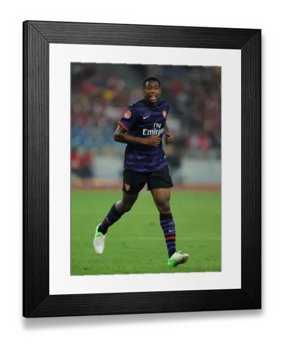 Framed Print : Chuks Aneke in Action: Arsenal vs Malaysia XI (2012) Framed Print : Chuks Aneke in Action: Arsenal vs Malaysia XI (2012)