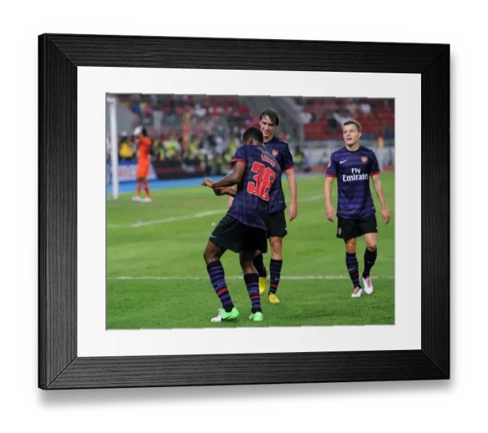 Framed Print : Chuks Aneke celebrates scoring Arsenals 2nd goal. Malaysia 1: 2 Arsenal