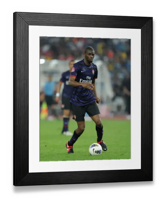 Framed Print : Abou Diaby in Action: Arsenal vs Malaysia XI (2012)