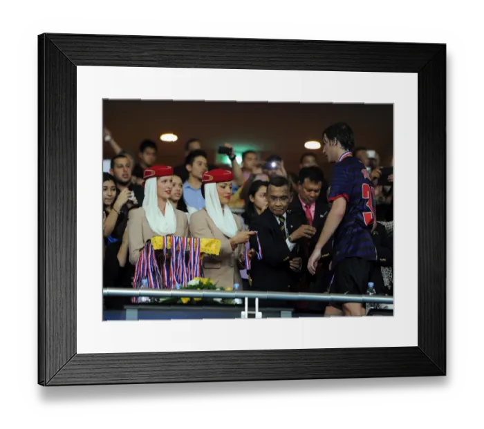 Framed Print : Emirates cabin crew help with the post match presentation. Malaysia 1: 2 Arsenal