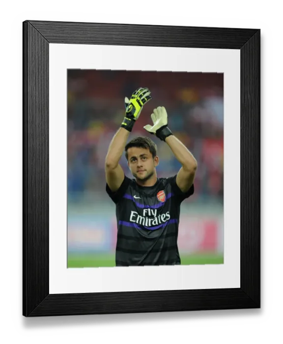 Framed Print : Lukasz Fabianski Prepares for Arsenal's 2012-13 Malaysia Tour Match Framed Print : Lukasz Fabianski Prepares for Arsenal's 2012-13 Malaysia Tour Match