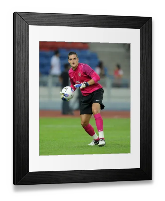 Framed Print : Arsenal's Vito Mannone in Action against Malaysia XI (2012)