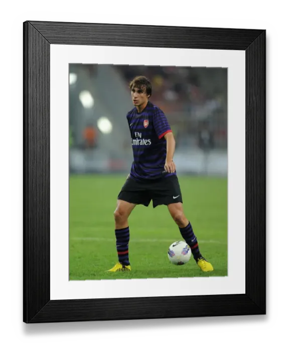 Framed Print : Ignasi Miquel in Action: Arsenal vs Malaysia XI (2012-13)
