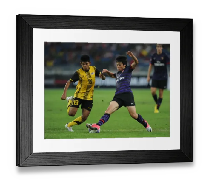 Framed Print : Ryo Miyaichi vs Ahmad Shakir Md Ali: Clash in the 2012-13 Malaysia XI vs Arsenal Match Framed Print : Ryo Miyaichi vs Ahmad Shakir Md Ali: Clash in the 2012-13 Malaysia XI vs Arsenal Match