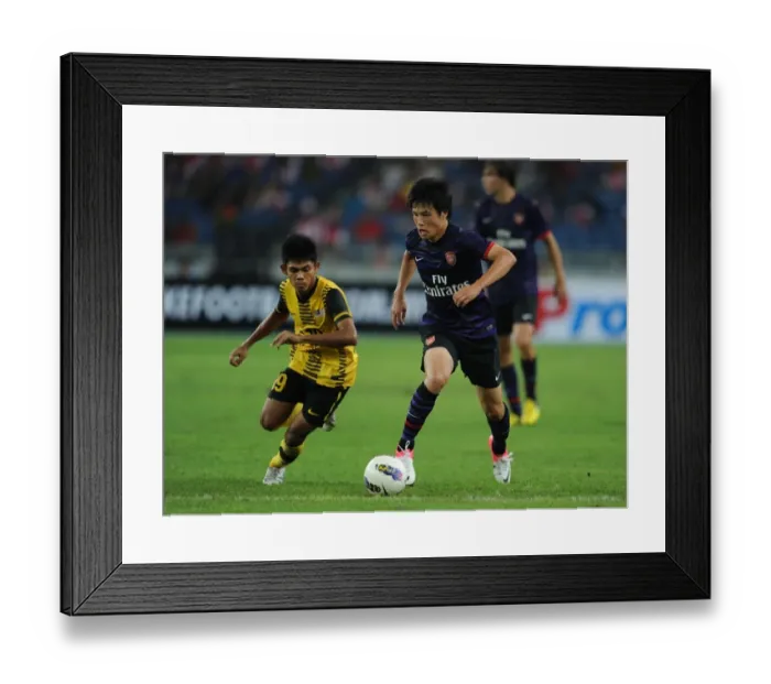 Framed Print : Ryo Miyaichi vs Ahmad Shakir Md Ali: A Football Showdown in the 2012-13 Arsenal Pre-Season Match in Kuala Lumpur Framed Print : Ryo Miyaichi vs Ahmad Shakir Md Ali: A Football Showdown in the 2012-13 Arsenal Pre-Season Match in Kuala Lumpur
