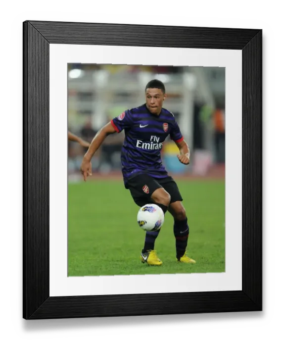 Framed Print : Alex Oxlade-Chamberlain in Action for Arsenal vs Malaysia XI (2012-13) Framed Print : Alex Oxlade-Chamberlain in Action for Arsenal vs Malaysia XI (2012-13)