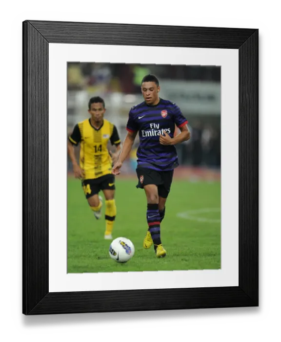 Framed Print : Alex Oxlade-Chamberlain Scores in Pre-Season Friendly: Arsenal Overcomes Malaysia 2-1 Framed Print : Alex Oxlade-Chamberlain Scores in Pre-Season Friendly: Arsenal Overcomes Malaysia 2-1