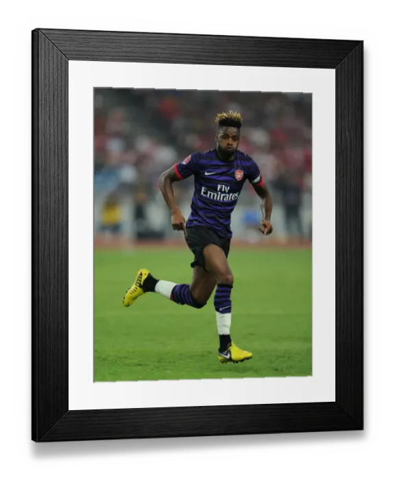 Framed Print : Alex Song: In Action for Arsenal against Malaysia XI, 2012 Framed Print : Alex Song: In Action for Arsenal against Malaysia XI, 2012