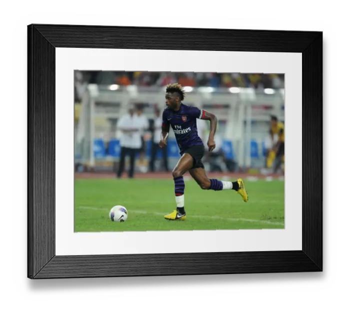 Framed Print : Alex Song in Action: Arsenal vs Malaysia XI, 2012 Framed Print : Alex Song in Action: Arsenal vs Malaysia XI, 2012