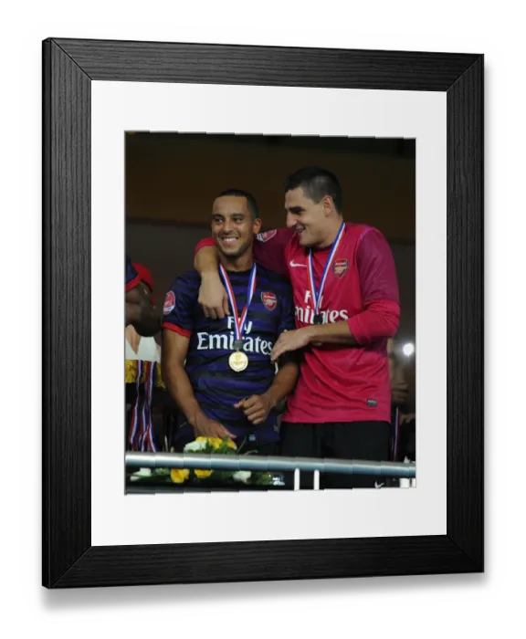 Framed Print : Theo Walcott and Vito Mannone (Arsenal). Malaysia 1: 2 Arsenal. Pre Season Friendly Framed Print : Theo Walcott and Vito Mannone (Arsenal). Malaysia 1: 2 Arsenal. Pre Season Friendly
